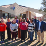 NEST grads with Dr. Clinton in front of the whatley center