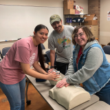 psi beta students with cpr dummy