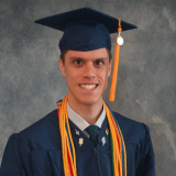 Luke McCraw in graduation regalia