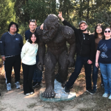 students with bigfoot statue