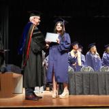 graduate getting diploma