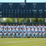 baseball team in front of new scoreboard