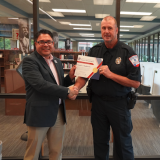 madden receives certificate from rose