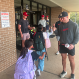 baseball greeting kids