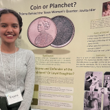 Mendoza in front of research poster